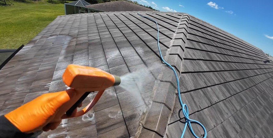 Roof cleaning in progress removing algae in West Palm Beach