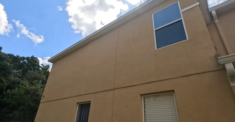 Clean stucco wall after pressure washing in West Palm Beach