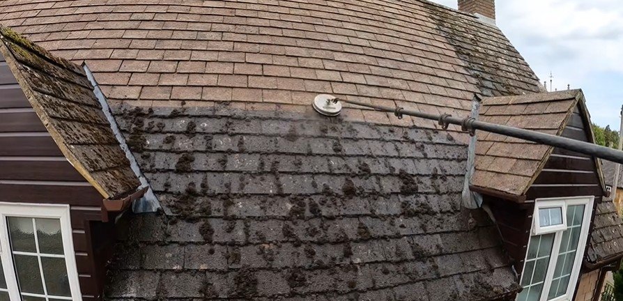 Roof cleaning in progress on a West Palm Beach home